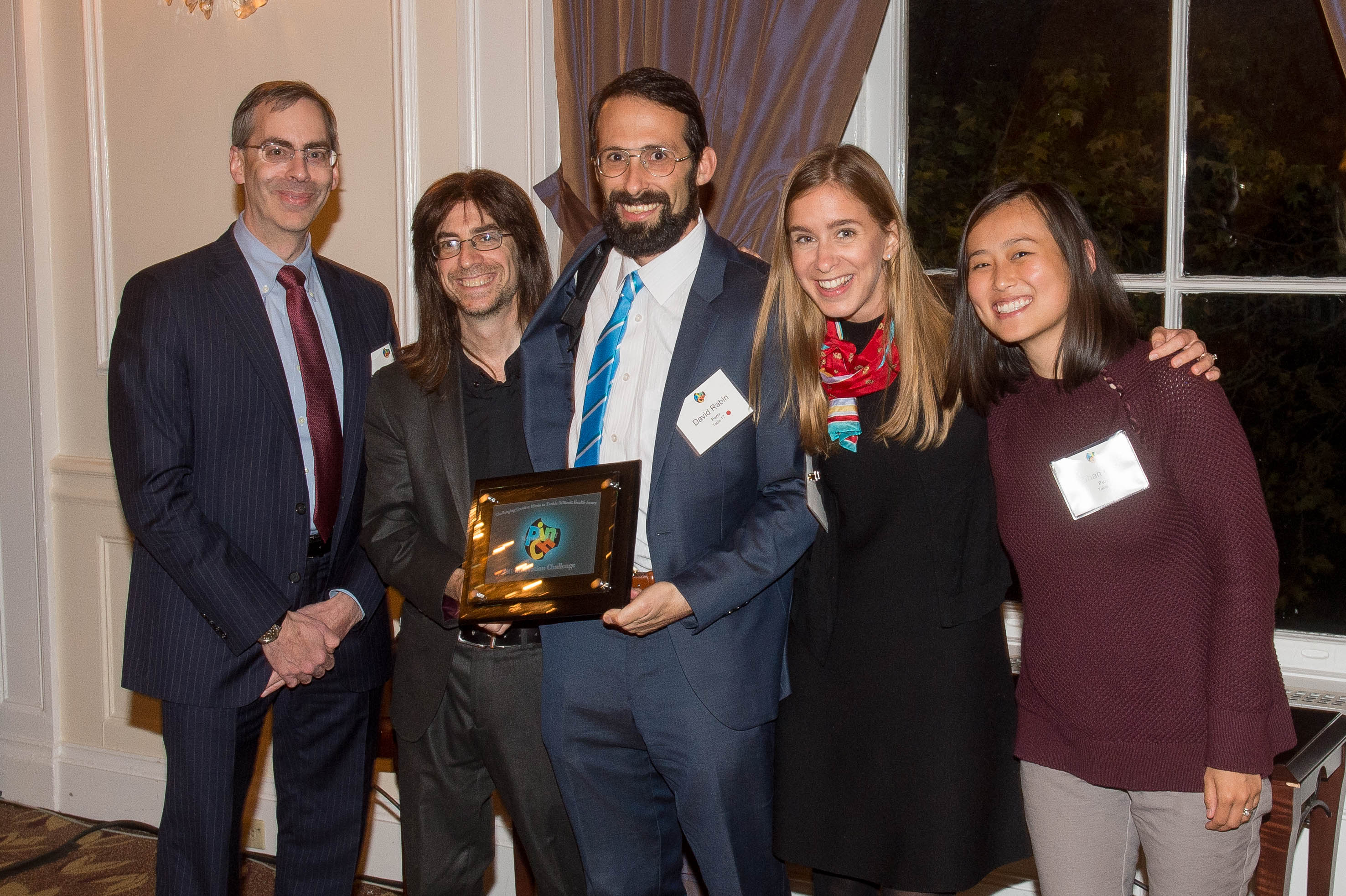 Purrr team holding award