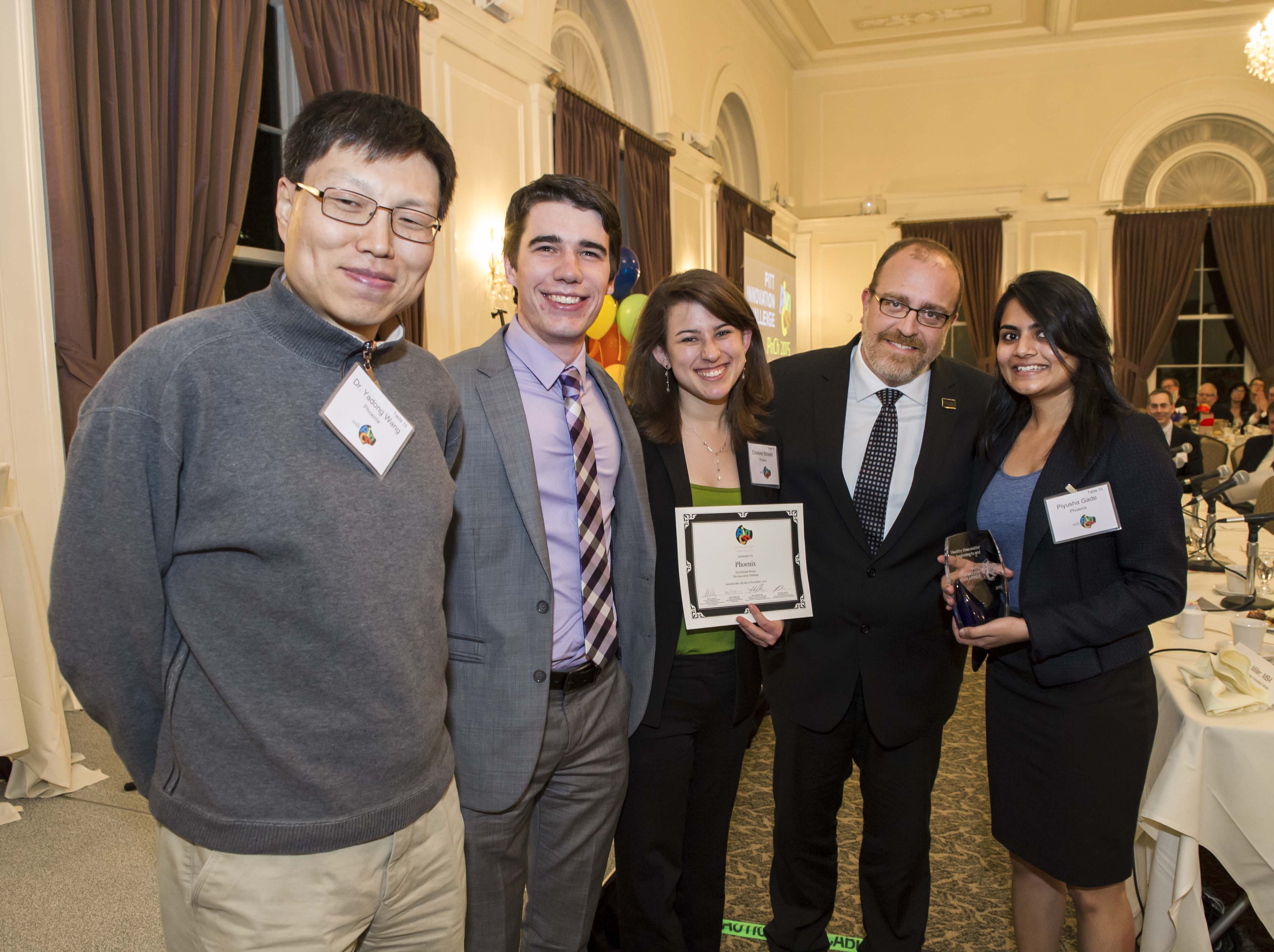 Phoenix team holding award