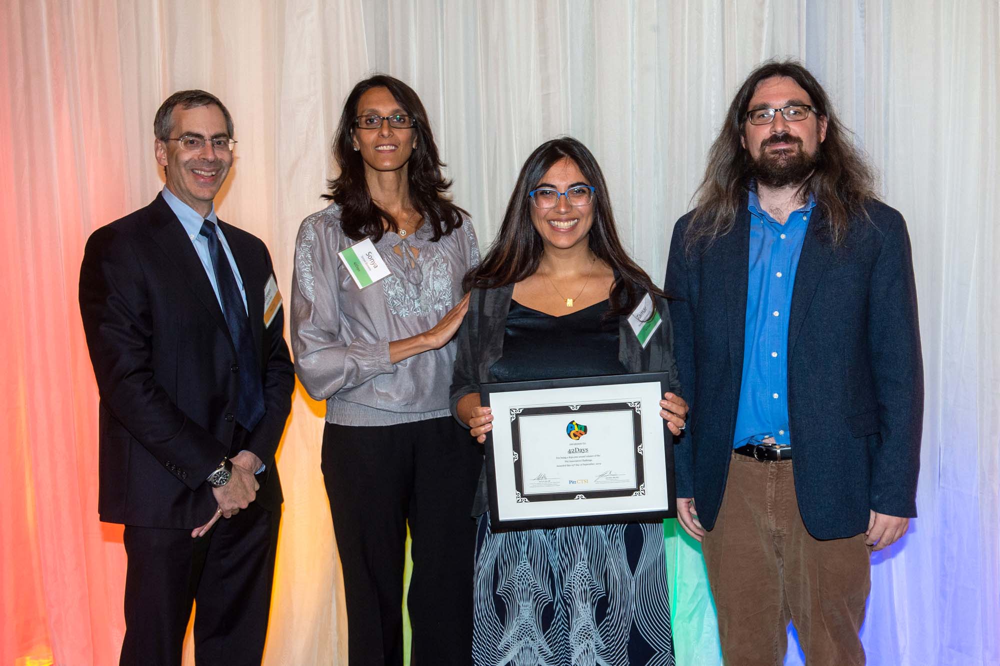 42Days team holding award