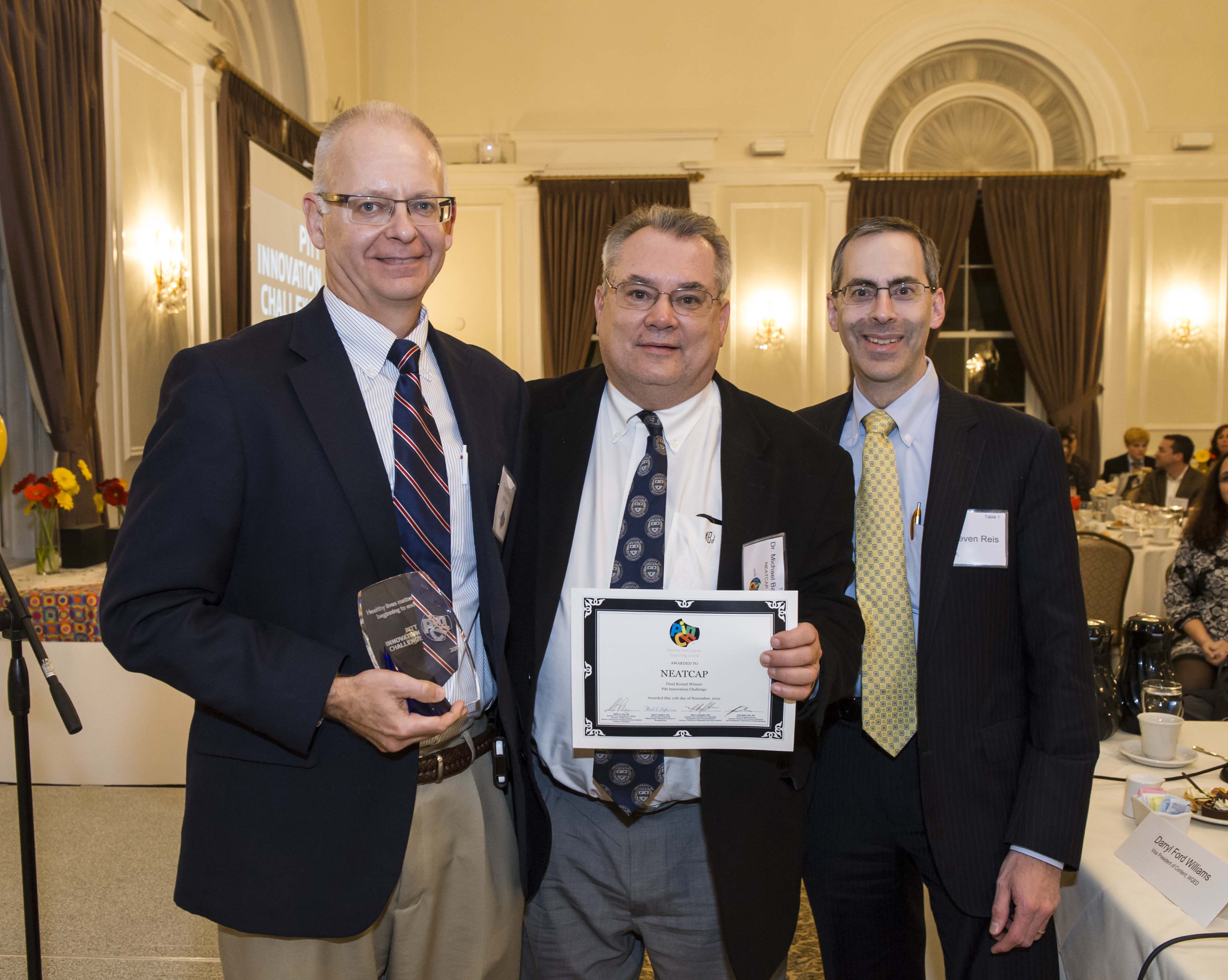 NEATCAP team holding award